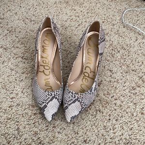 - Pink snakeskin pumps